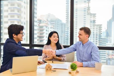 Man shake hand customer couple, Consumer Lending, Financial Services | DXC Technology